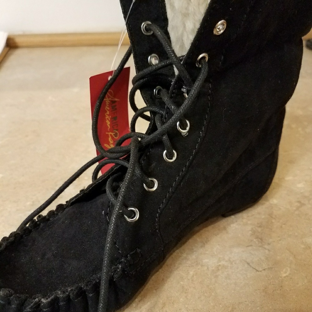 Black moccasin boots